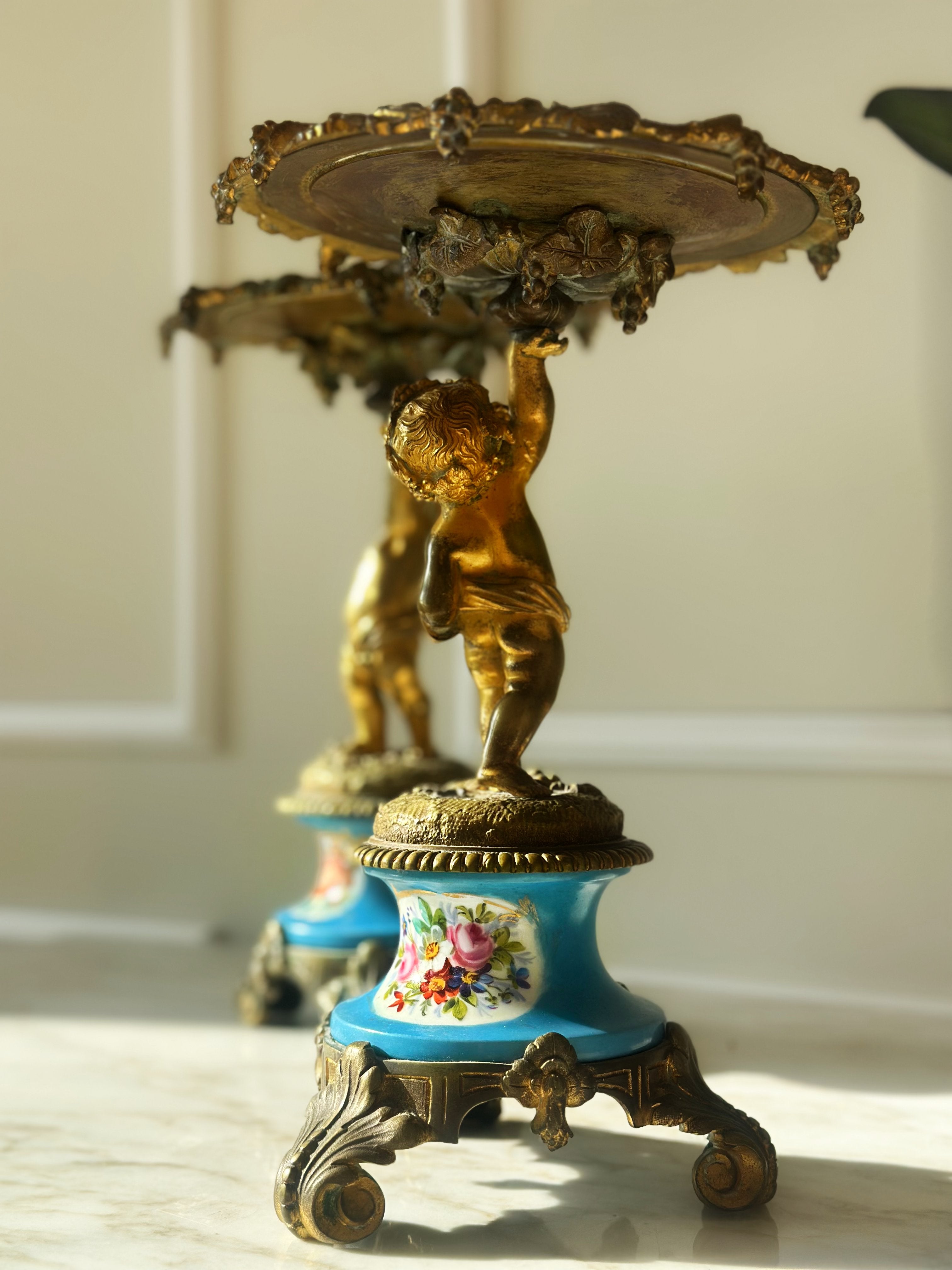 A Pair of Gilt Cherub Tazza Stands