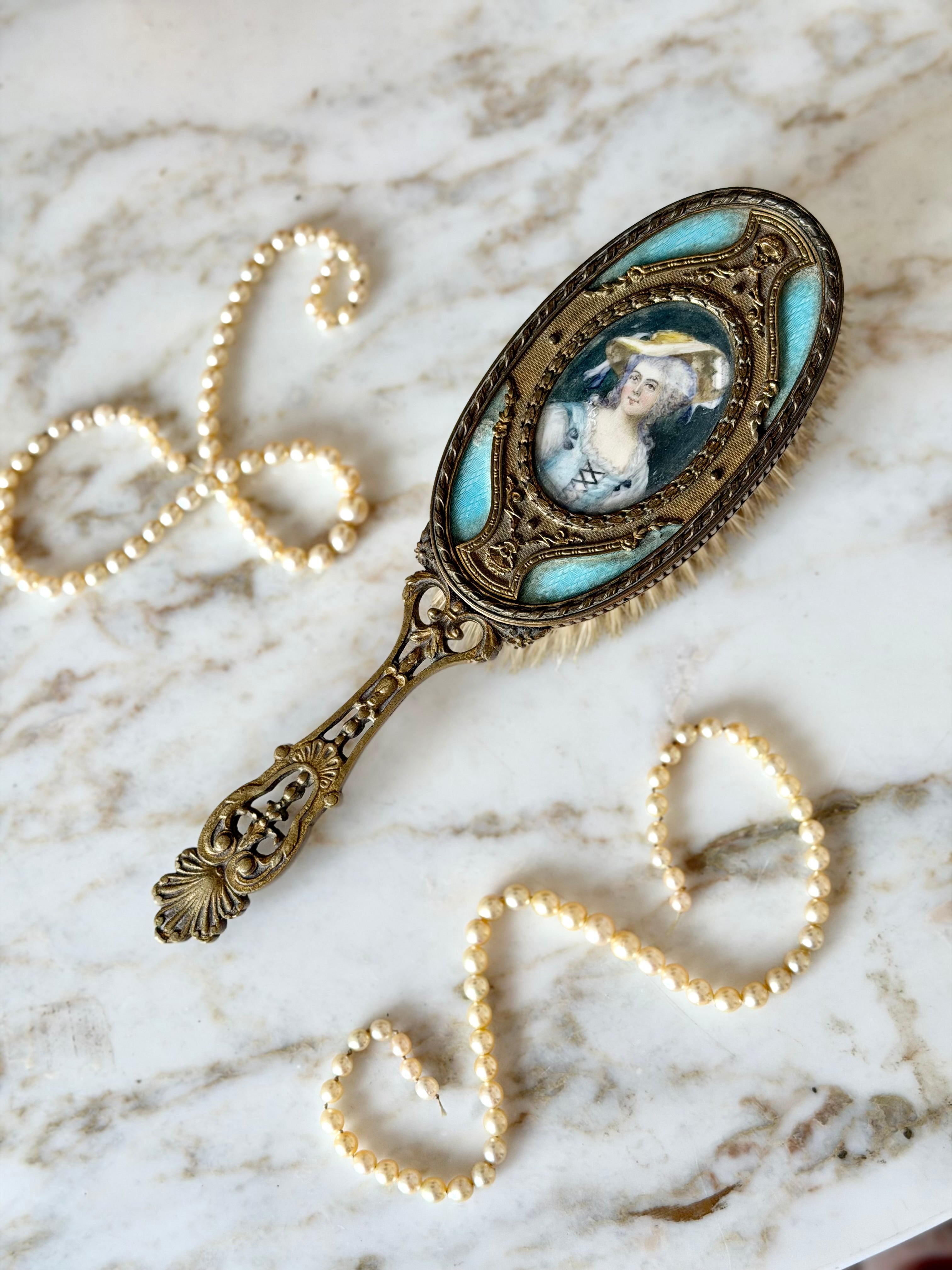 Gilt French guilloché hairbrush with a portrait