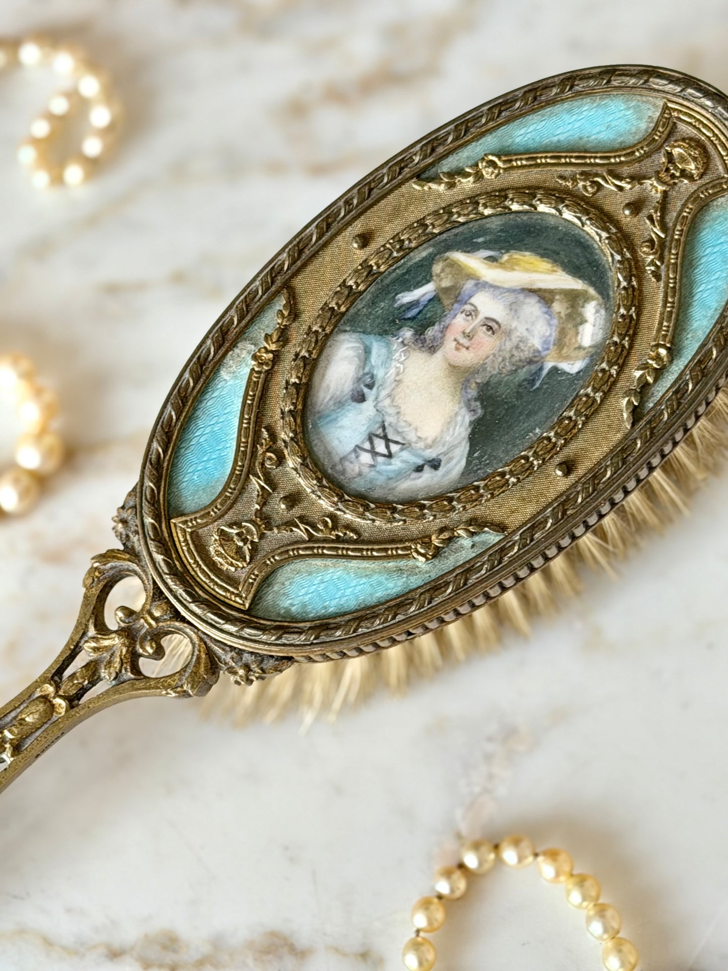 Gilt French guilloché hairbrush with a portrait