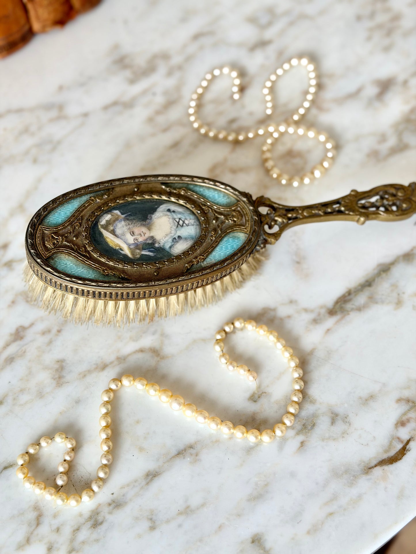 Gilt French guilloché hairbrush with a portrait