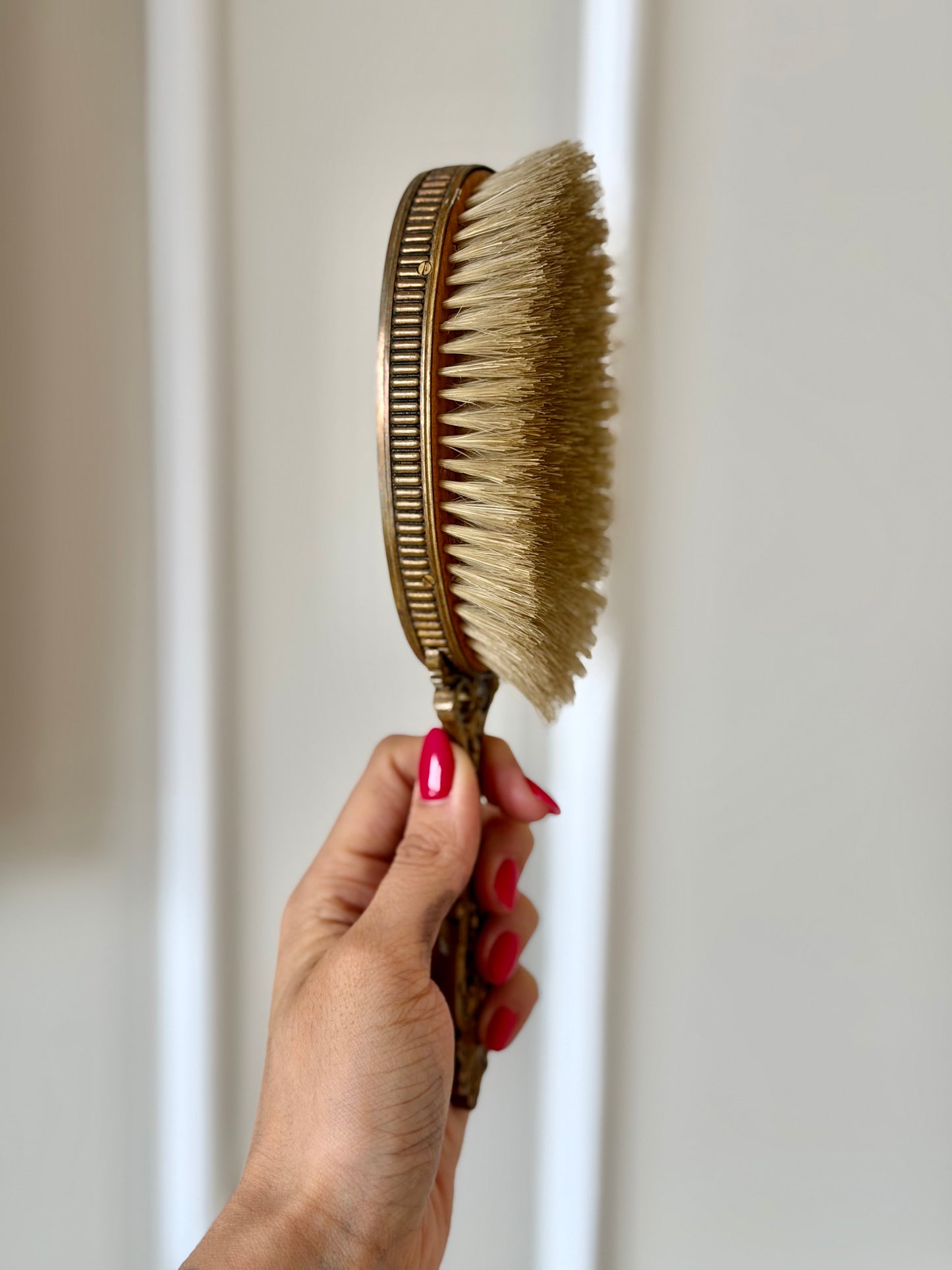 Gilt French guilloché hairbrush with a portrait
