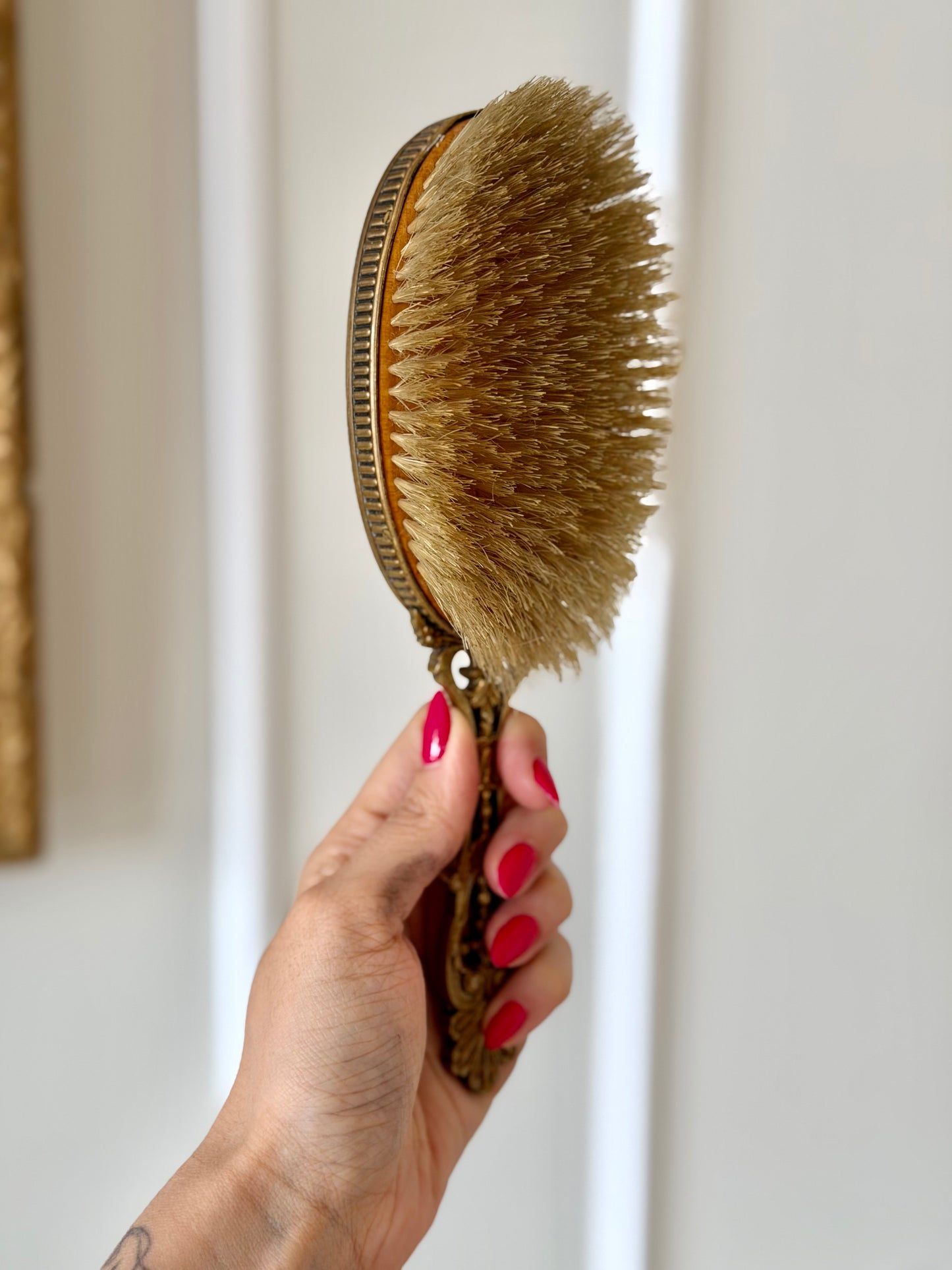 Gilt French guilloché hairbrush with a portrait