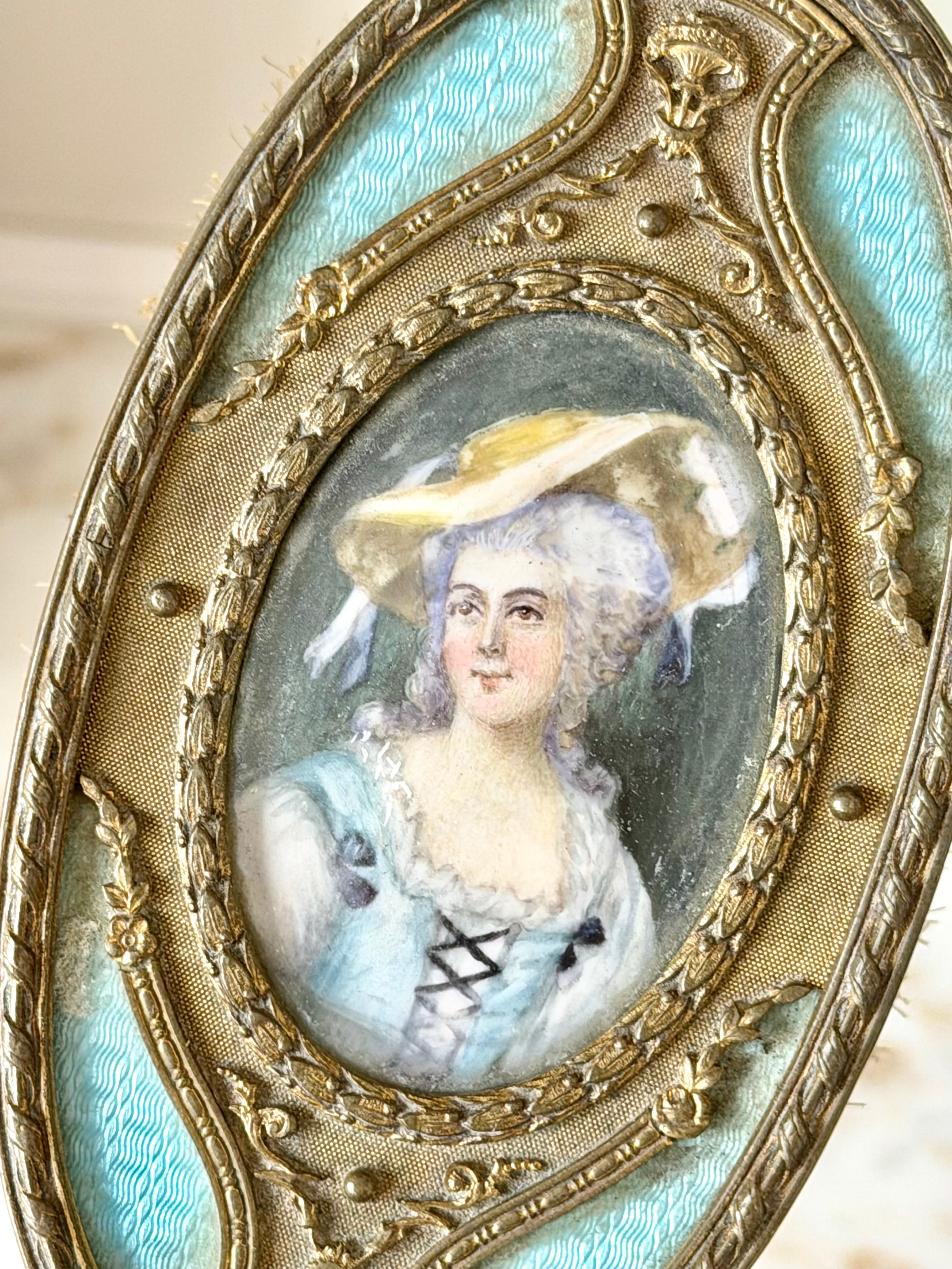 Gilt French guilloché hairbrush with a portrait