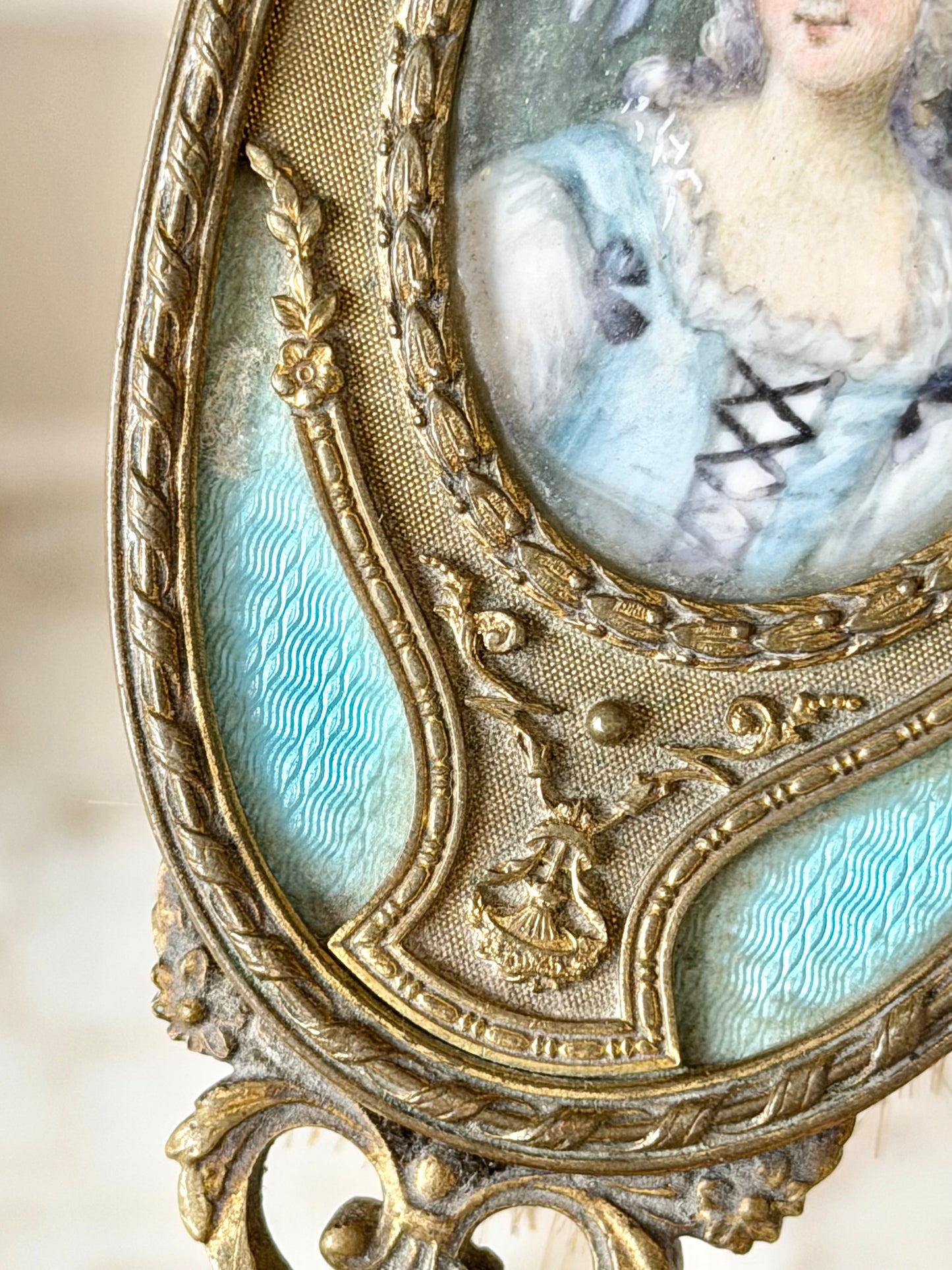 Gilt French guilloché hairbrush with a portrait