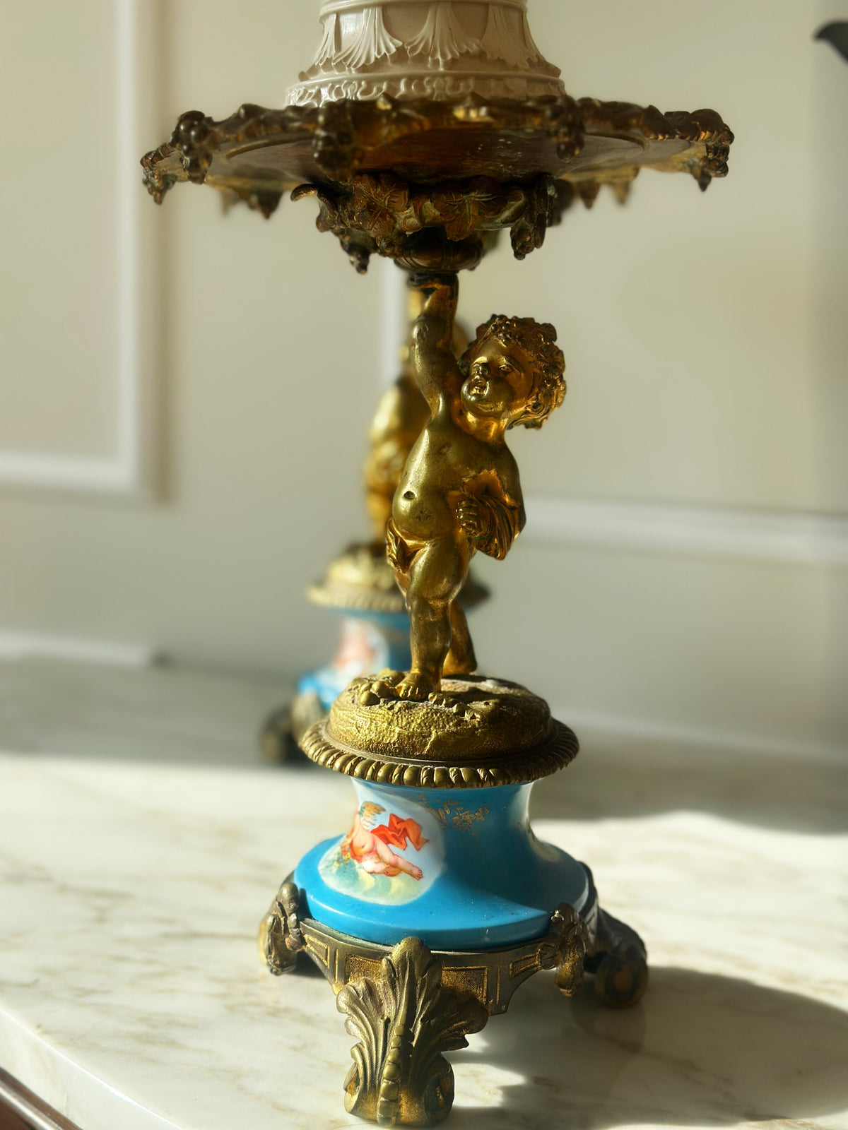 A Pair of Gilt Cherub Tazza Stands