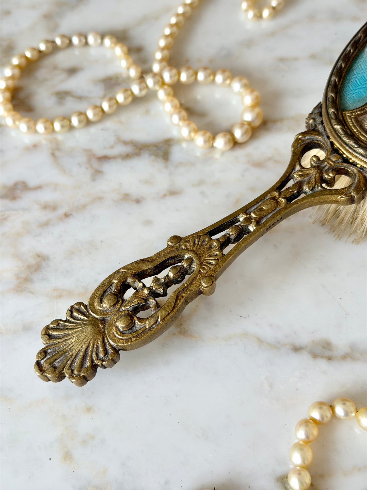 Gilt French guilloché hairbrush with a portrait