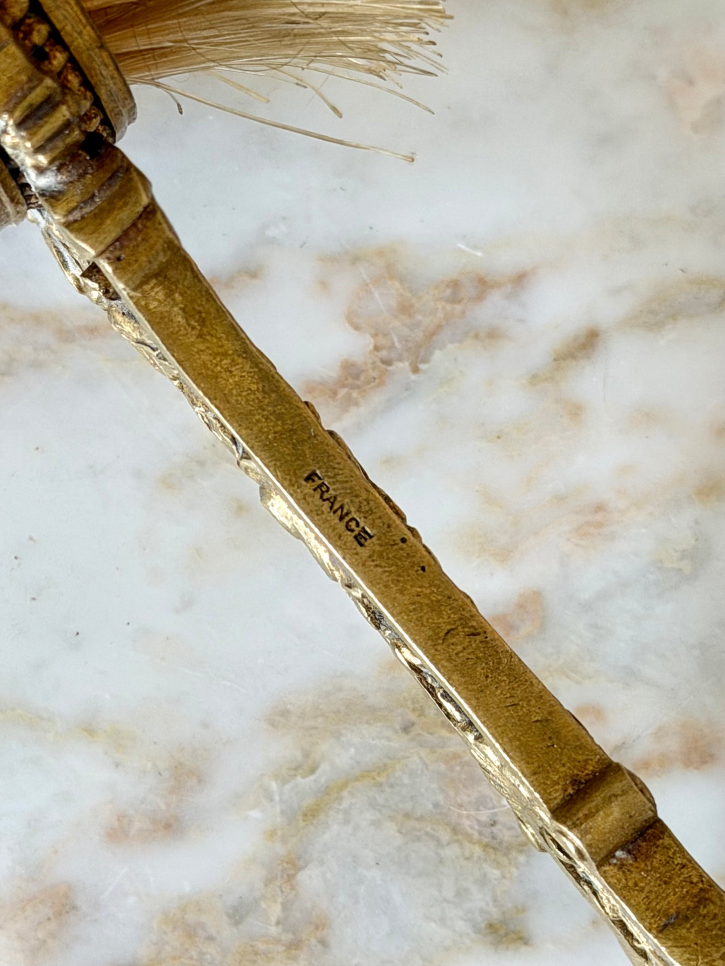 Gilt French guilloché hairbrush with a portrait